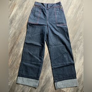 High waisted, wide leg, dark denim jeans with contrast stitching.